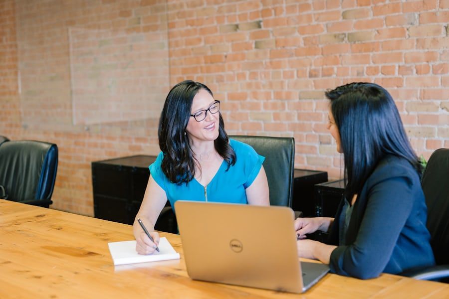 Adviser and owner-director discussing the future of the business